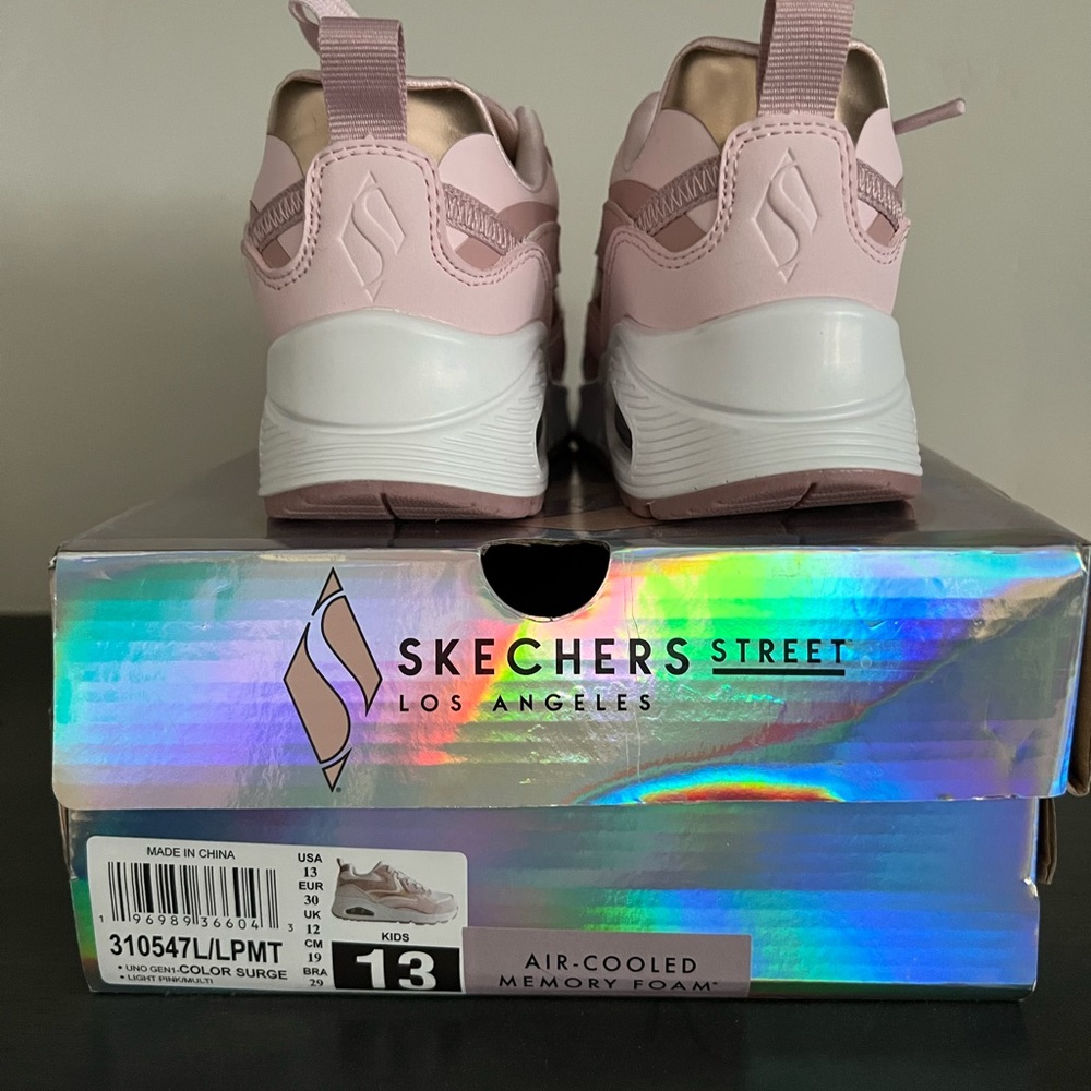 Brand new pair of Skechers tennis shoes size 13.